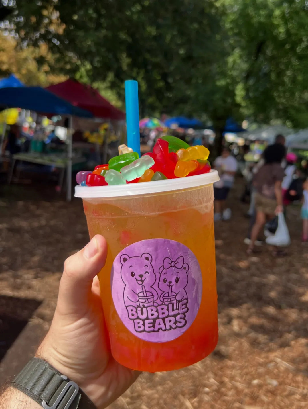 An orange Bubble Bears drink with candy